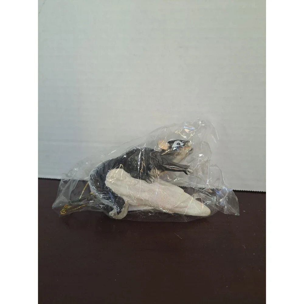 Charming Tails Skunk On Snowflake Sled Ornament
